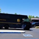 ups driving on a street